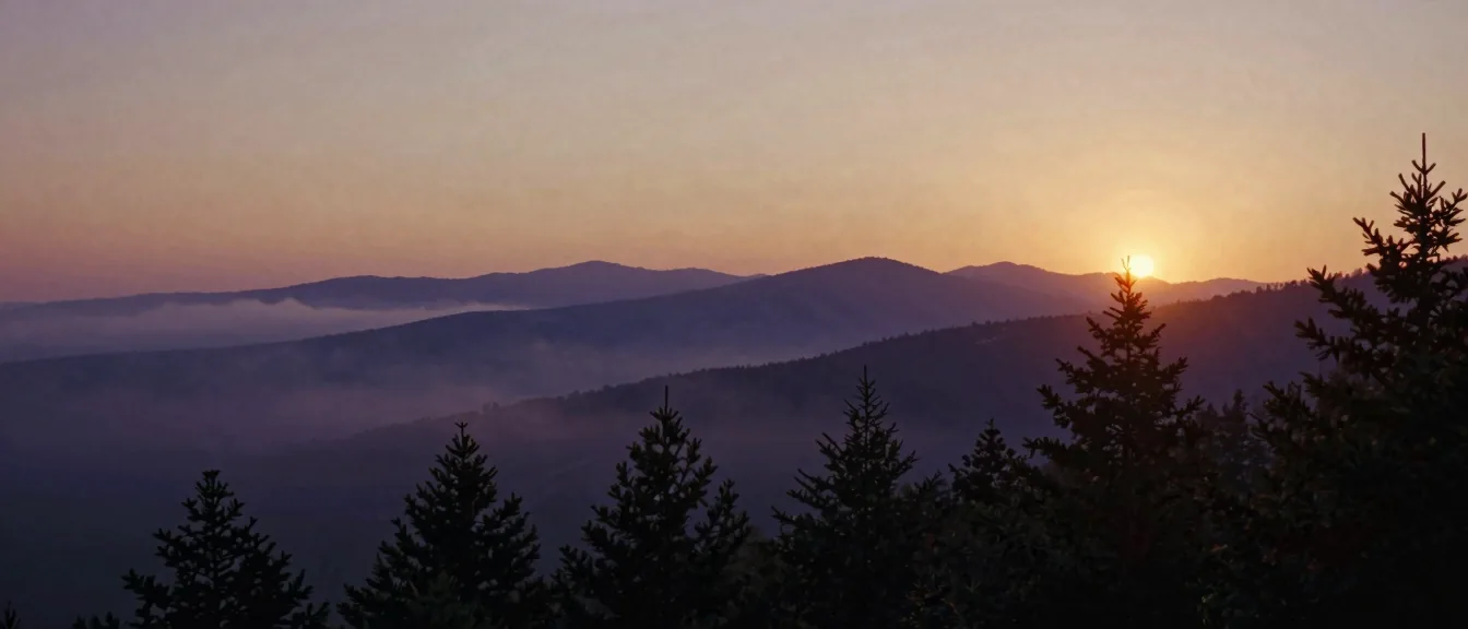Layered Blue Ridge ridgelines with valley fog between them at dawn