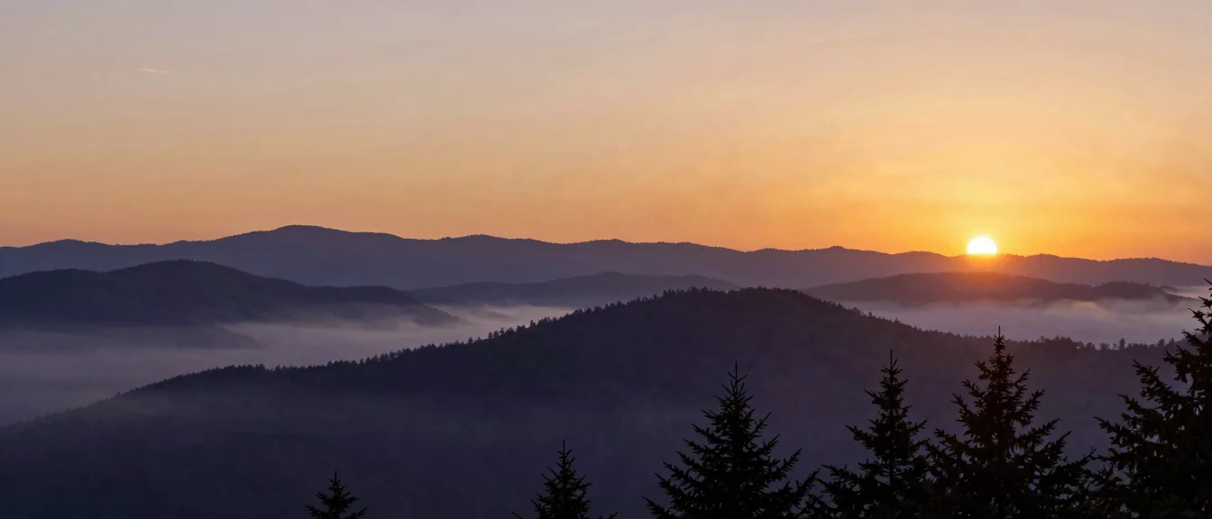 Blue Ridge ridgelines receding into dawn fog